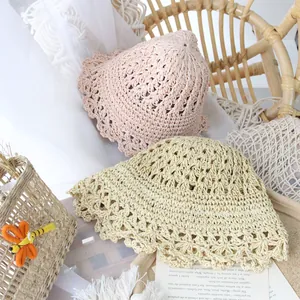 Cute hand-woven sun hats with scalloped edges for girls in light pink and beige