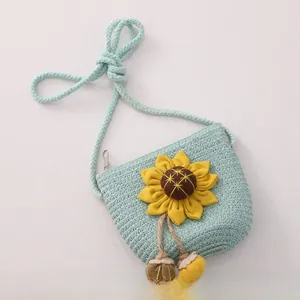 Detail of mint green woven sunflower crossbody bag for girls with zipper and rope strap