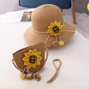 Detail of straw hat and matching sunflower crossbody bag set for young girls