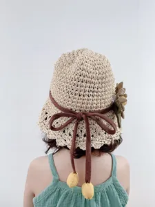 Chapeau de soleil tressé pour enfants avec fleur verte et nœud pour la plage