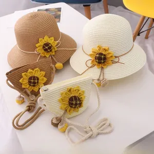Detail of children's straw hat and bag set with yellow sunflower accents in beige