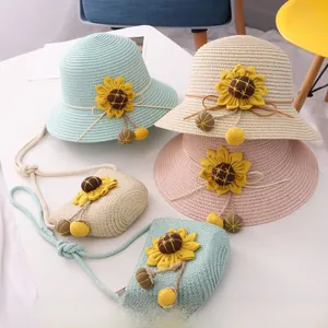 Detailed weave of girls sunflower straw sun hat and matching crossbody bag in pastel colors