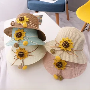 Detail showing woven straw hats in five colors with sunflower accents and tassel straps