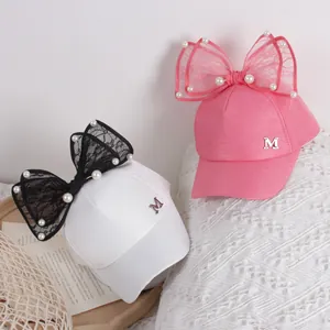 Girl's sweet pink and white baseball caps with lace bows, pearls and metal M logo