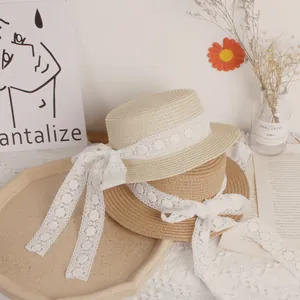 Handwoven girls' straw hats in beige and khaki with elegant floral lace bow ribbons