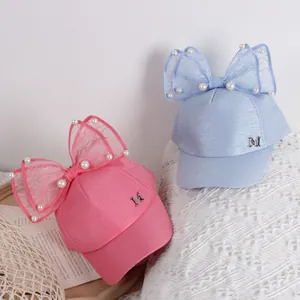 Girls summer baseball caps with large lace bows, pearls and metal M letter logo