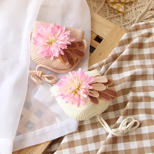 Mini floral straw bags for girls in beige and white with large pink flower accents