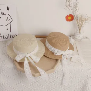 Girls summer straw sun hats with wide lace ribbons in cream and light brown colors