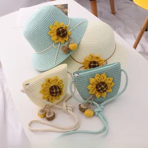 Detailed view of kids sunflower straw hat and matching crossbody bag in mint and beige