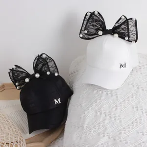 Girls' baseball cap with large lace bow, pearls, and M letter in black and white