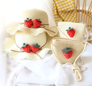 Summer girls straw hat and matching strawberry crossbody bag set with wavy brim detail