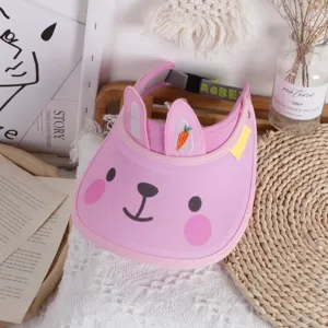 Detailed view of pink rabbit sun visor with adjustable strap and carrot embroidery