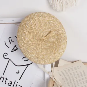 Minimalist straw beret hat for kids in natural tan with fine woven texture for summer