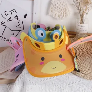 Detail of cartoon giraffe sun visor for girls featuring adjustable elastic strap and stitching