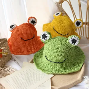 Handmade woven frog sun hats for kids in bright orange, yellow, and green colors