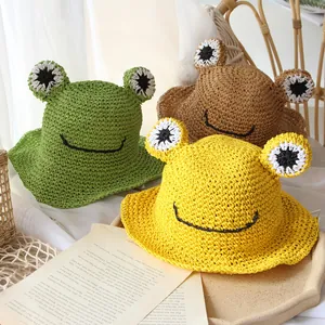 Handmade frog straw hats for kids in green, yellow, and khaki with wide wavy brims