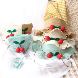 Kids handwoven straw hat and bag set with cute red crochet cherry decor and wavy brim