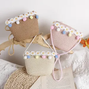 Handwoven straw bags for girls with daisy lace and colorful pom-poms in three soft colors
