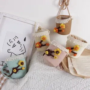 Handmade crochet flower bucket bags for toddlers in five pastel colors with lace trim