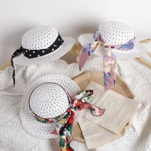 Three breathable straw sun hats for kids featuring decorative colorful ribbon streamers