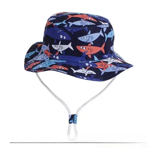 Detail of blue sun hat for girls featuring colorful shark prints and adjustable chin strap