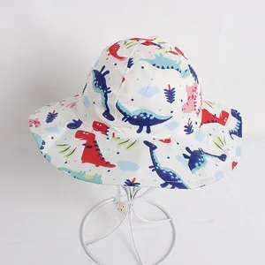 Kids wide brim sun hat with colorful dinosaur pattern on breathable beige cotton fabric