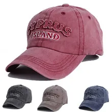 Detail showing various colors of washed cotton baseball caps with Cyprus Island embroidery