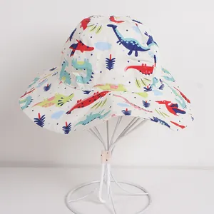 Kids breathable cotton sun hat featuring colorful cartoon dinosaur prints and wide wavy brim