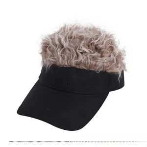 Detail of black canvas visor cap with light brown curly wig hair attached on top