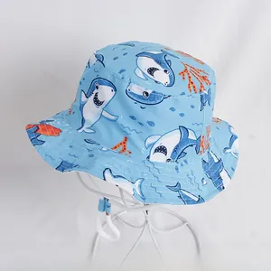 Detail of baby sun hat with ocean shark print and adjustable white chin strap