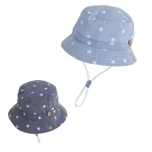 Blue and gray infant sun hats with white star patterns and adjustable chin straps