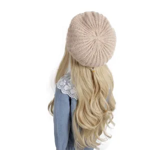 Winter beige knitted beret hat for kids with soft wool-like texture on white background