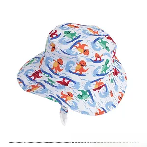Close-up of kids sun bucket hat with colorful cartoon dinosaurs and white chin strap