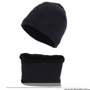 Detail of black knitted beanie and neck warmer set with xhboy embroidery and fleece lining