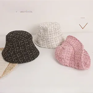 Detailed view of kids tweed bucket hats featuring shiny silver thread and soft lining