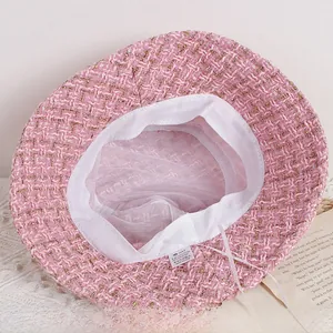 Macro detail of kids pink tweed bucket hat showing mesh lining and adjustable drawstring