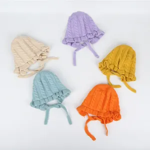 Winter knitted baby hats with ruffles and ties in five pastel colors for infant girls