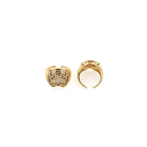 Macro shot of 18K gold plated tiger head ring featuring cubic zirconia and black enamel