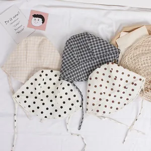 Set of four cotton baby sun hats with polka dots and checks featuring chin straps