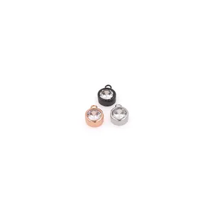 Three 18K gold-plated copper round pendants with sparkling cubic zirconia in various colors
