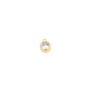 Macro shot of 18K gold plated pendant featuring a brilliant round cut zircon crystal