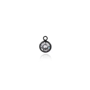 Macro view of 18K gold plated zircon pendant in black finish with a clear round crystal