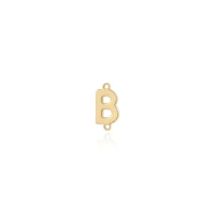 Macro detail of 18K gold plated letter B connector with dual rings for DIY jewelry making