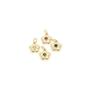Macro shot of 18K gold-plated flower pendants with colorful cubic zirconia insets