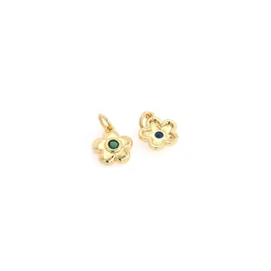 Detail of 18K gold plated flower charms with inlaid green and blue cubic zirconia stones