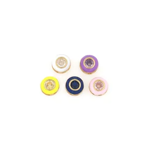Close-up of 18K gold plated enamel beads with colorful gemstones for DIY jewelry