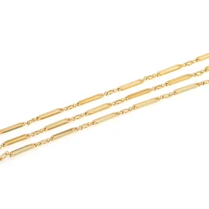Detailed close-up of 18K gold-plated bar links and tiny circular jewelry making chain