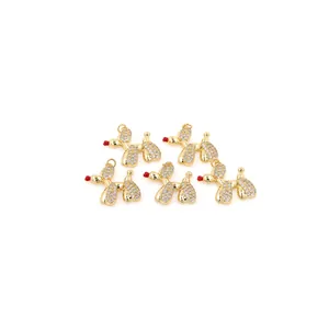 Detailed view of 18K gold-plated balloon dog pendants with sparkling zircon pavé