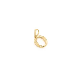 Detailed view of an 18K gold plated letter O pendant with bamboo texture and lobster clasp