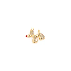 Detail of 18K gold-plated balloon dog pendant with pavé cubic zirconia and red nose